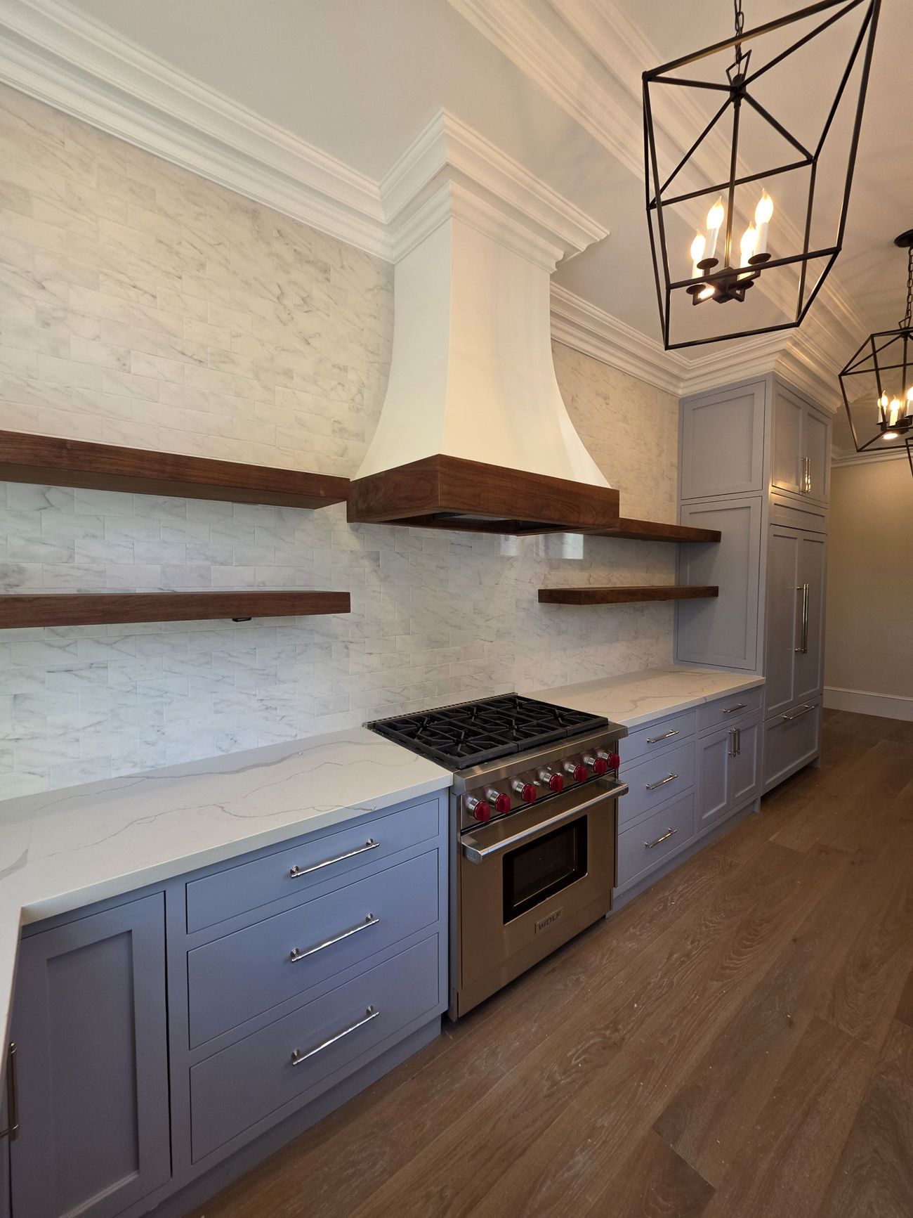Custom plaster hood with walnut shelves